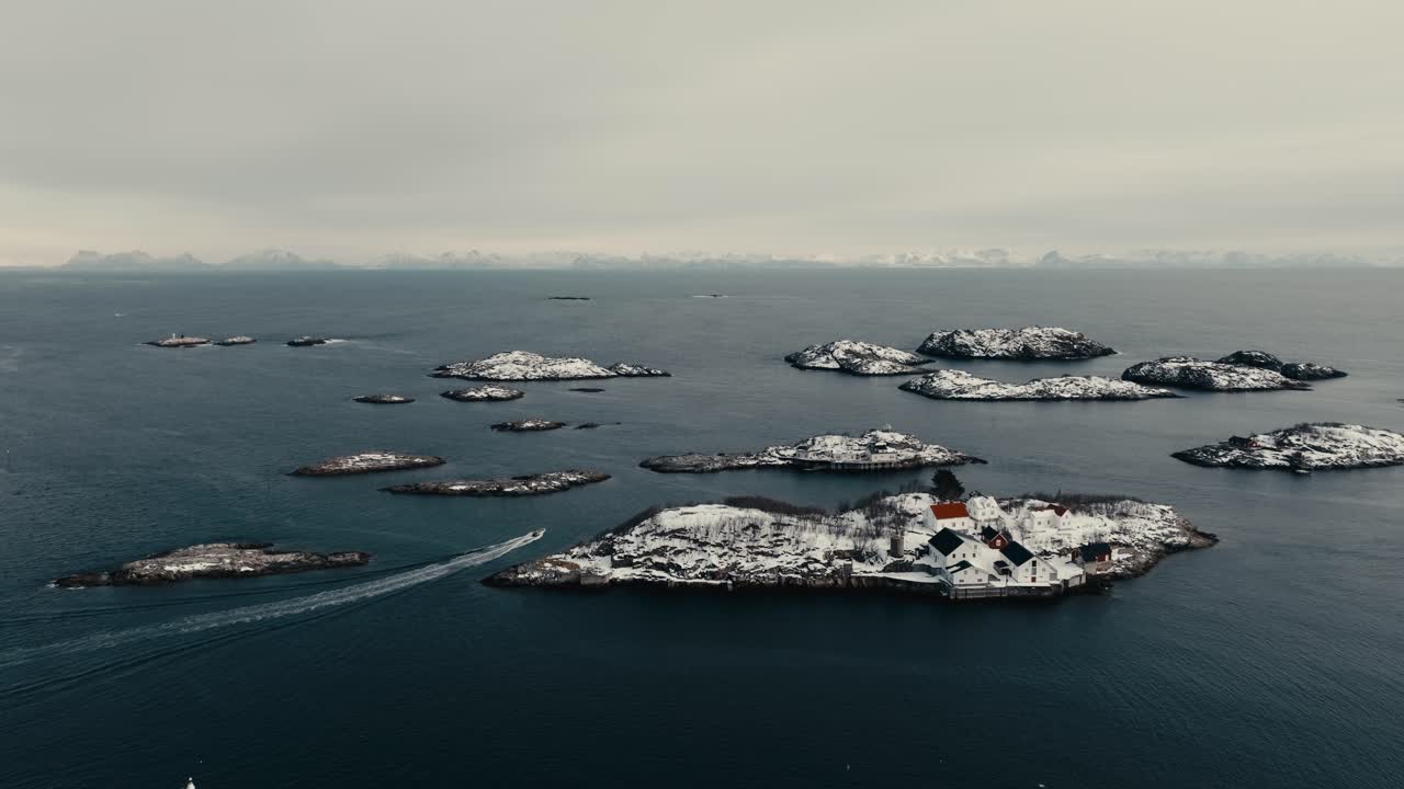 Snow-Covered Fishing Village Of Henningsvaer During Winter In Norway. Aerial Drone Shot