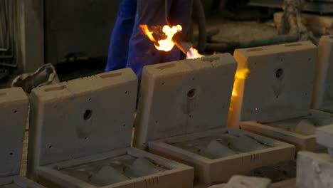 male worker heating molds in workshop 4k