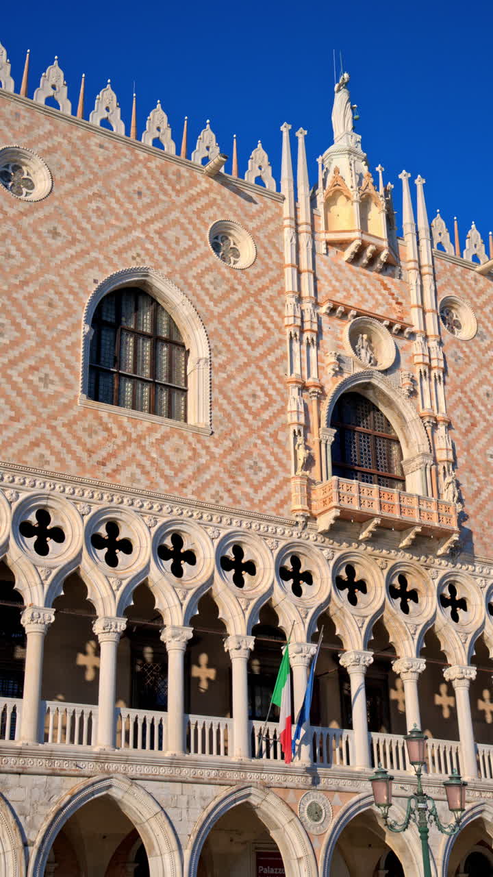View of Doge's Palace in St. Mark's Square, near a harbour in Venice City, Italy. Vertical