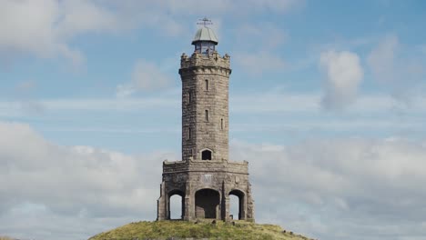 a view of darwen tower in lancashire on a windy day