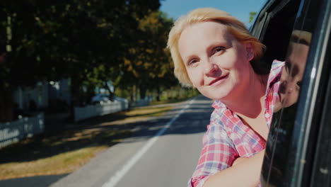 woman in car admires scenery