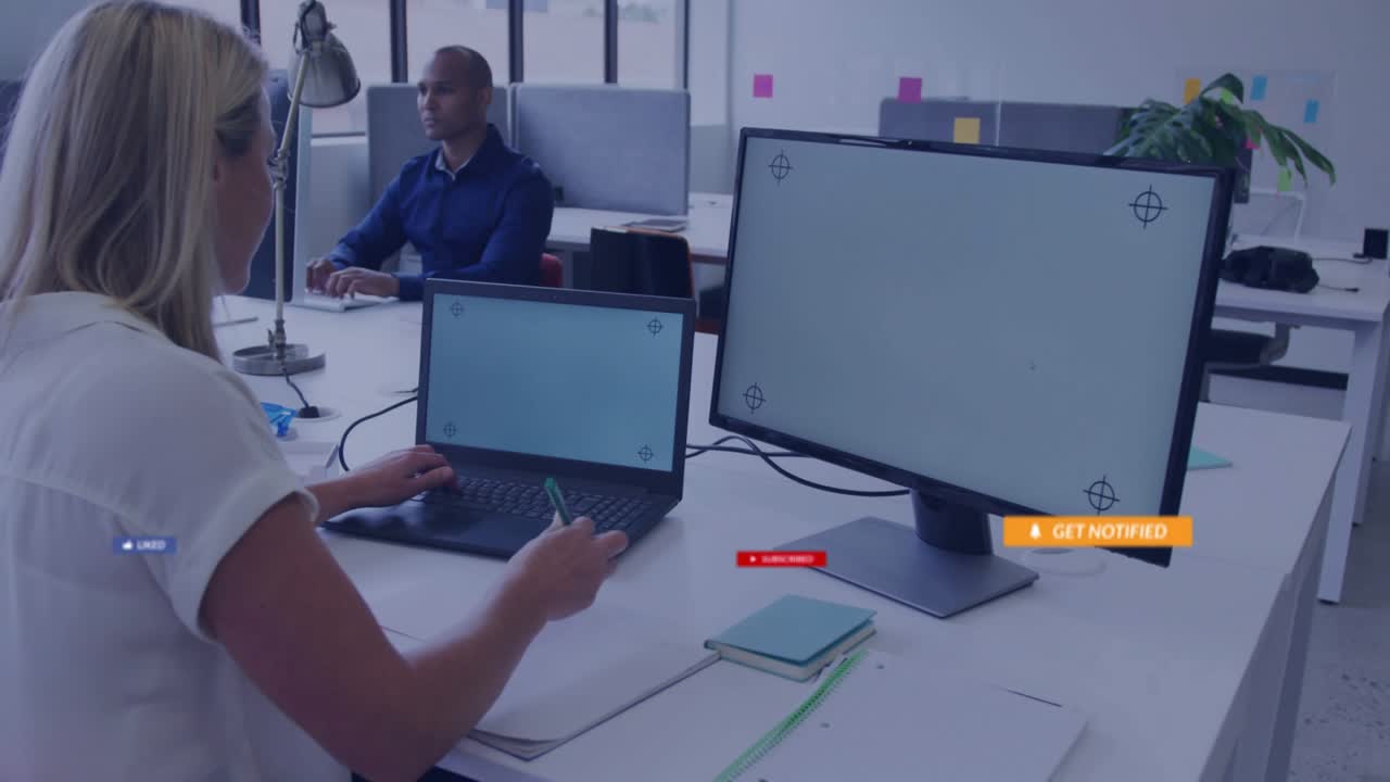 Designer sketching on laptop stylus summoning social media icons tapping like icons dissolving