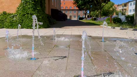 4K-60FPS-Close-up-View-of-Fountain-in-a-Swedish-Town-Outside-a-Protestant-Church