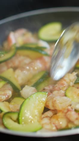 preparing pasta with shrimp and zucchini