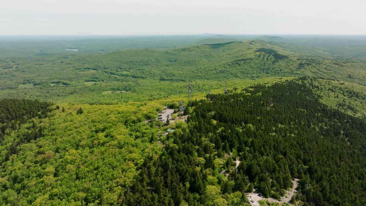 Drone footage of a fire tower outlook in new Hampshire with a beautiful view