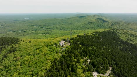 drone footage of a fire tower outlook in new hampshire with a beautiful view