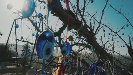 the evil eye bead depending to the tree