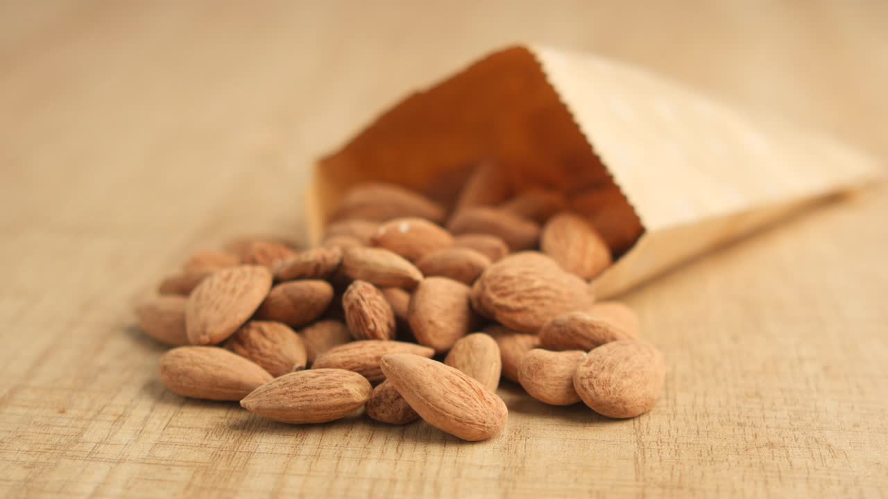 Almonds spilling from a bag