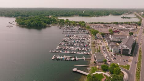 Aerial-drone-shot-of-a-bustling-boat-harbor-with-numerous-boats-at-the-docks