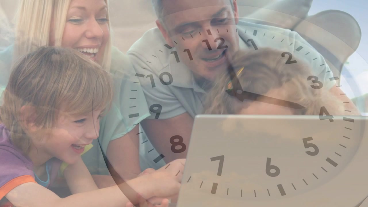 Family leaning around laptop kids touching screen and causing clock overlay moving for education