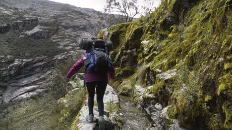 travelers with backpack at the mountain hike in huaraz, peru. static shot