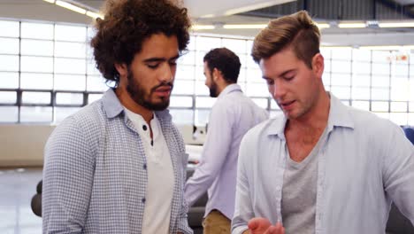 two male business executives interacting with each other