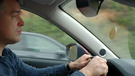 Car-driver-traveling-in-rainy-weather