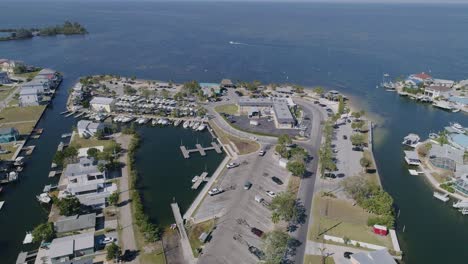 4k drone video of beach park, marina, and waterfront homes in hudson beach on the gulf of mexico in florida