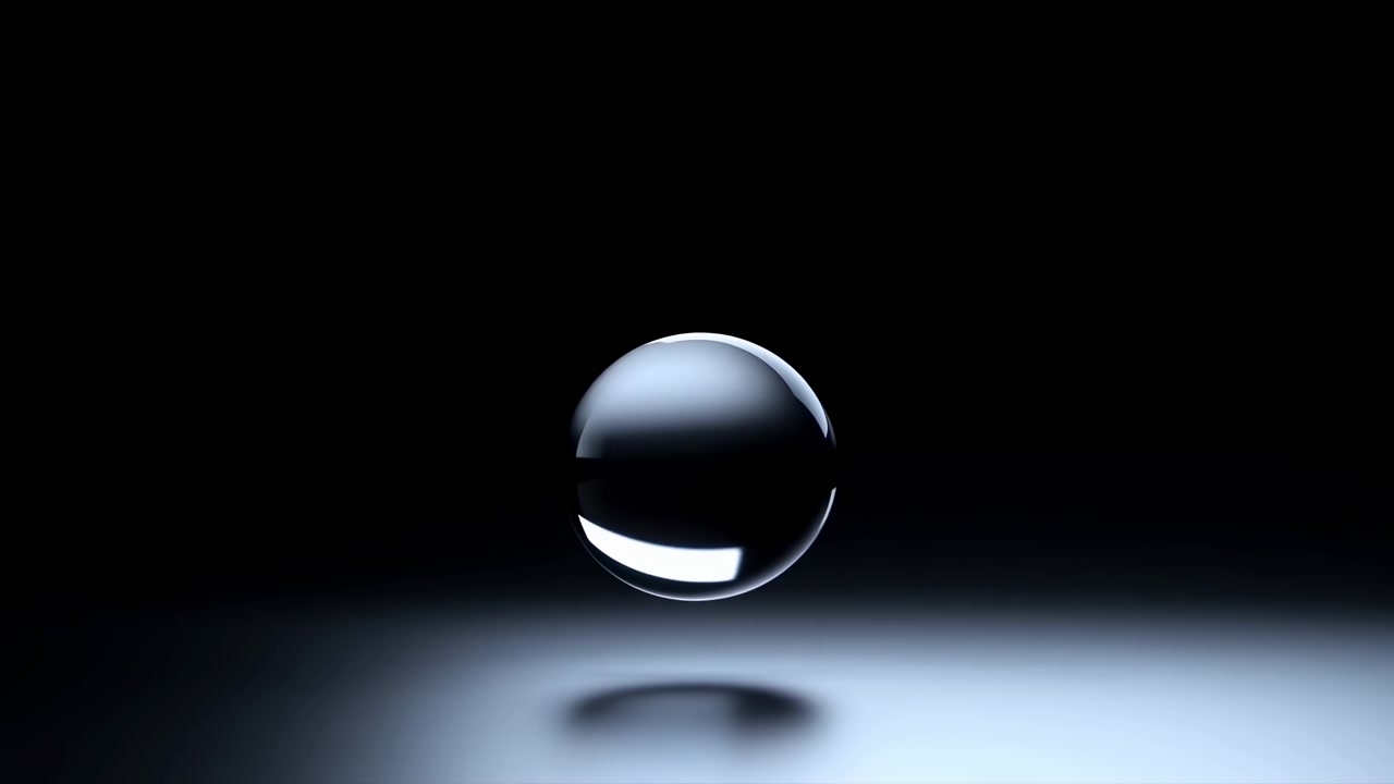 A glossy clear sphere hovers over a smooth reflective surface against a deep dark background, lit with soft studio lighting for a clean minimalist abstract