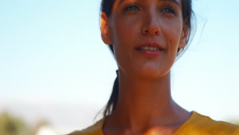 woman standing with the helmet in the ranch 4k