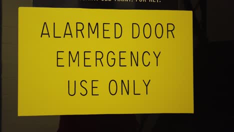 footage of an alarmed door use only sign