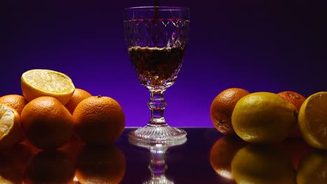 citrus fruits and drink in glass