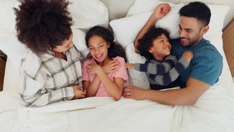 Family,-tickle-and-playful-in-bed