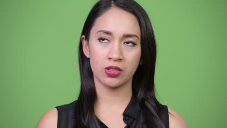 young beautiful asian businesswoman looking bored