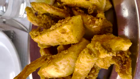 close-up of a plate of fried choco portuguese food in a restaurant