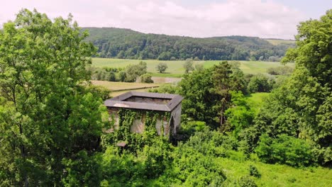 Defensive-tower-ruin-and-rolling-hills-scenery-of-countryside-Poland-aerial-view