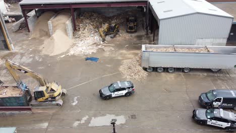 Police-vehicles-outside-of-an-old-industrial-buildings-area