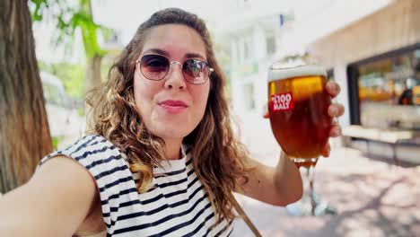 summer refreshment: tourist drinking beer in athens