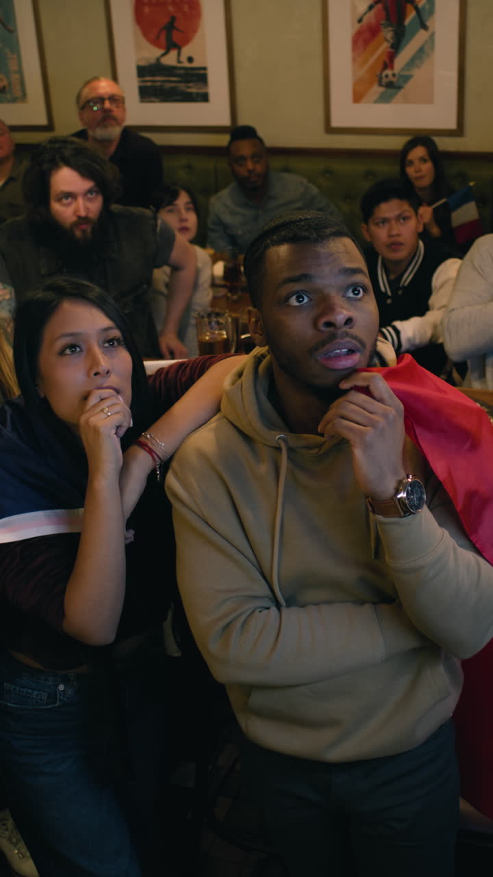 French Football Fans Celebrating in a Bar