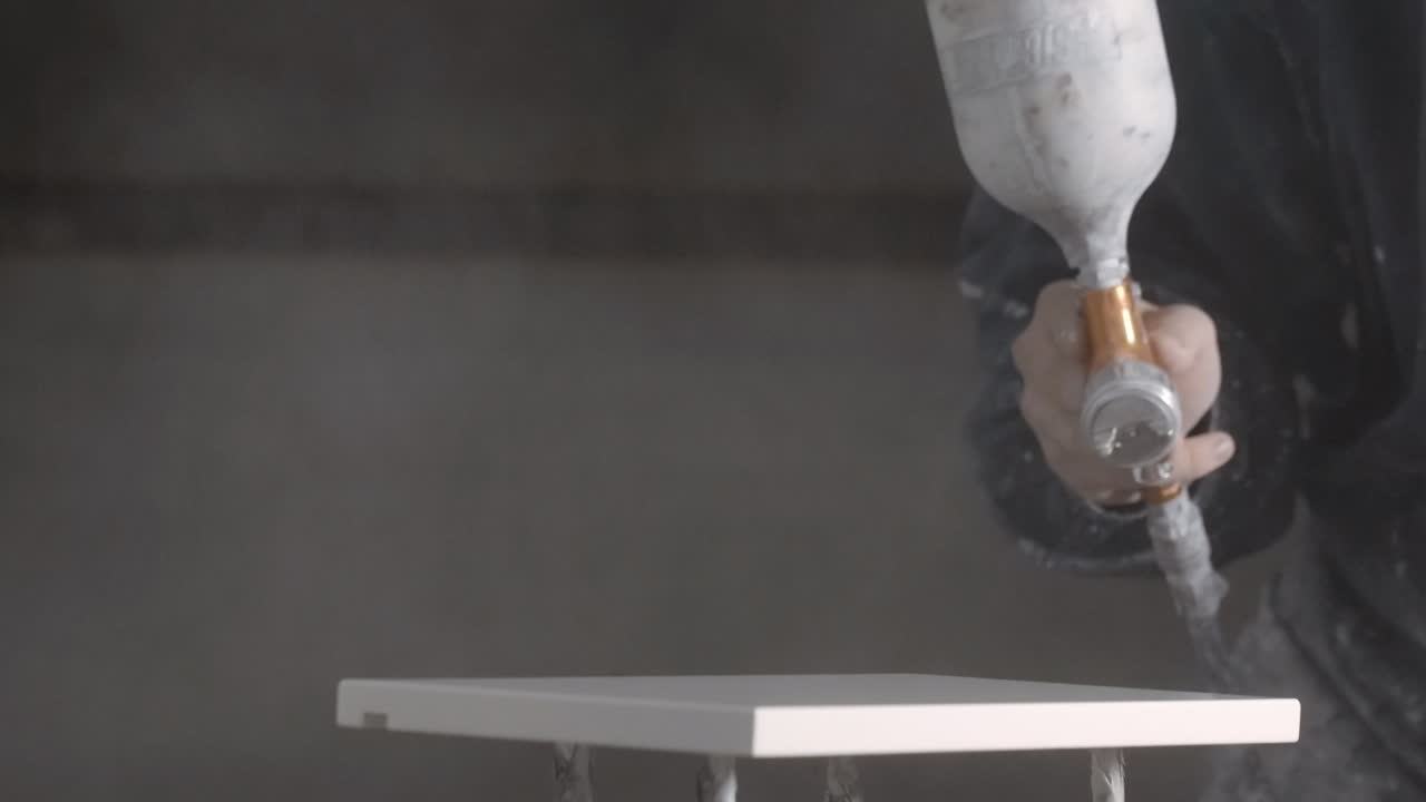 Spray Painting Furniture in a Workshop