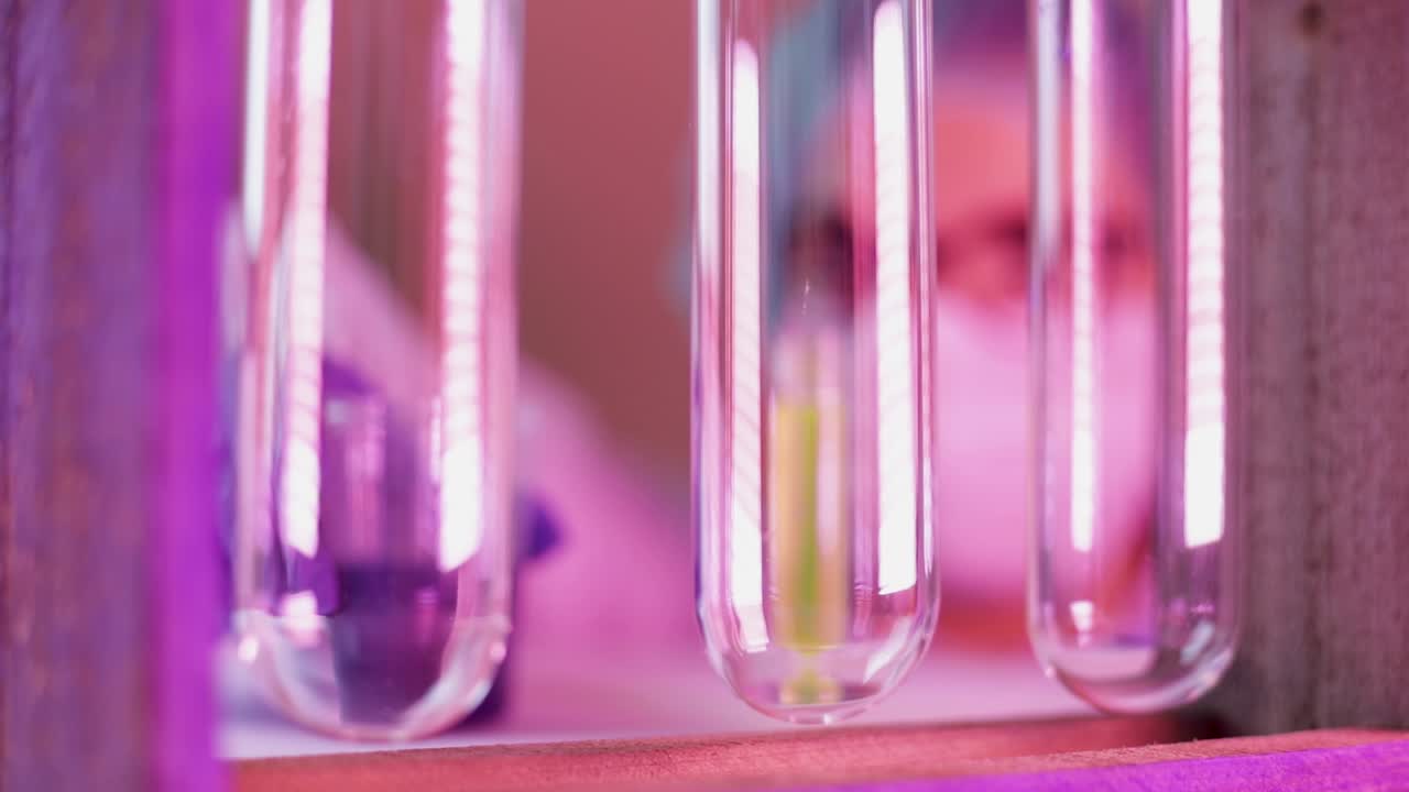 Pharmaceutical lab with colorful glass tub containing colorful liquid preparations spilled by the scientist analyzing Covid-19