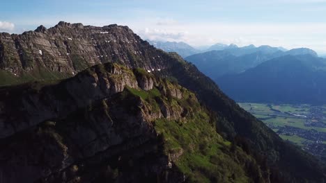 Panoramic-aerial-view-of-majestic-Chüemettler-mountain-of-the-Appenzell-Alps-in-Switzerland,-on-bright-sunny-day