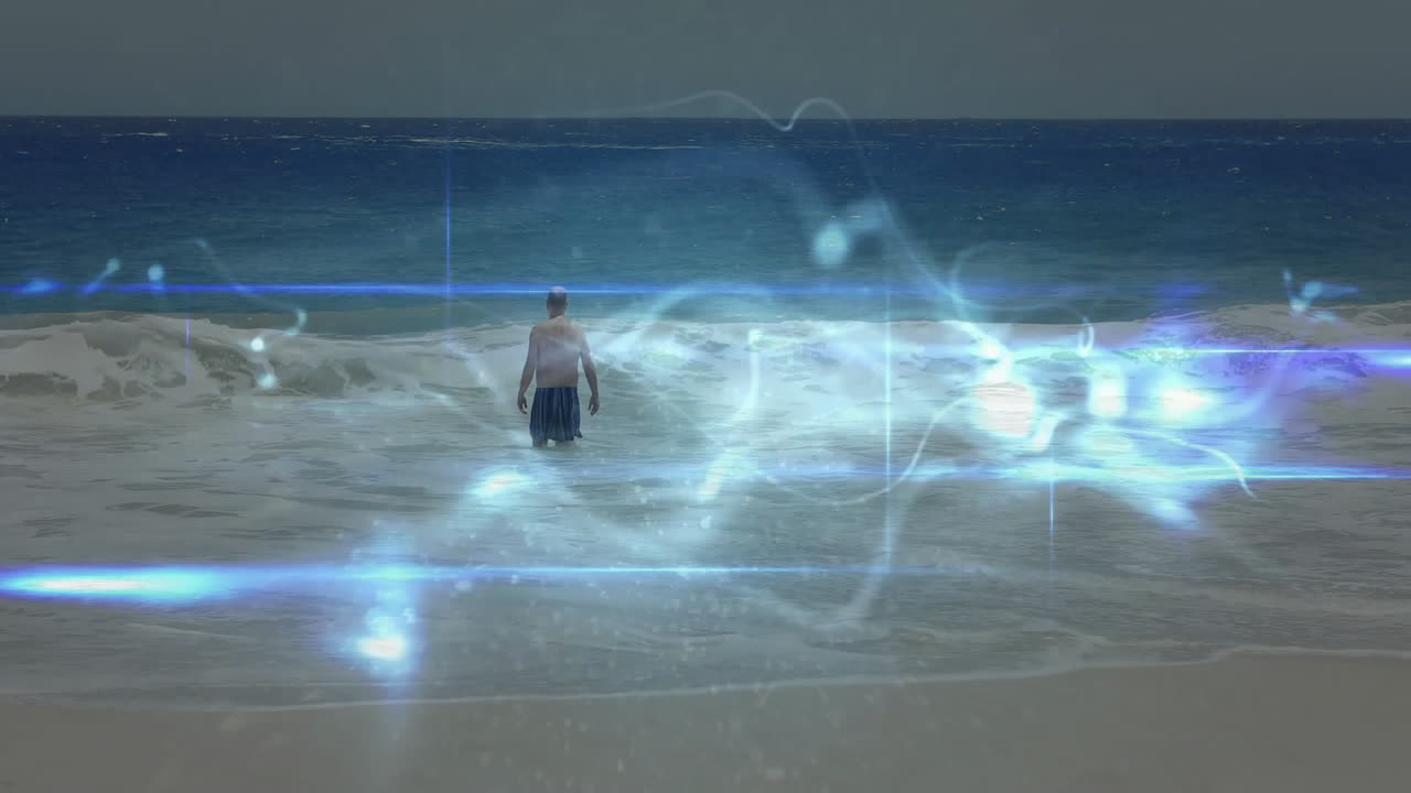 Standing in ocean waves, man surrounded by glowing animation light effects