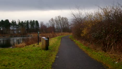 Wide-shot-of-the-Forth-and-Clyde-Canal-tow-path-in-winter