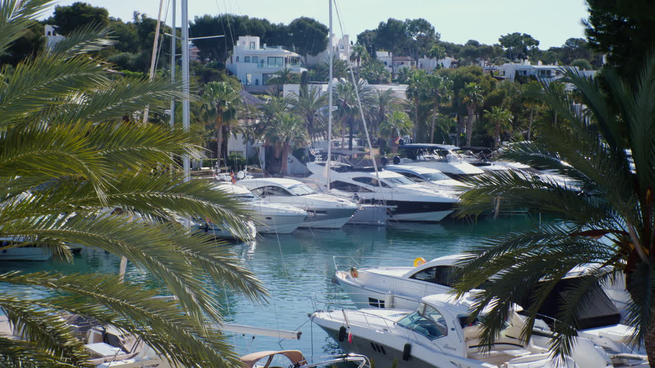 Cala D'or Marina with many yachts at daytime at the blue water