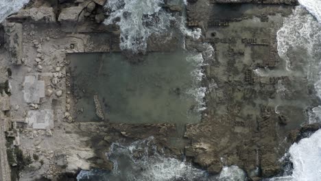 aerial view of ancient ruins at the coast