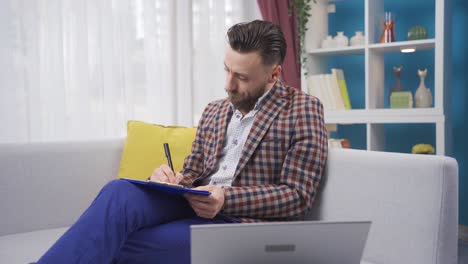 Tired businessman working at home using laptop and getting overwhelmed.