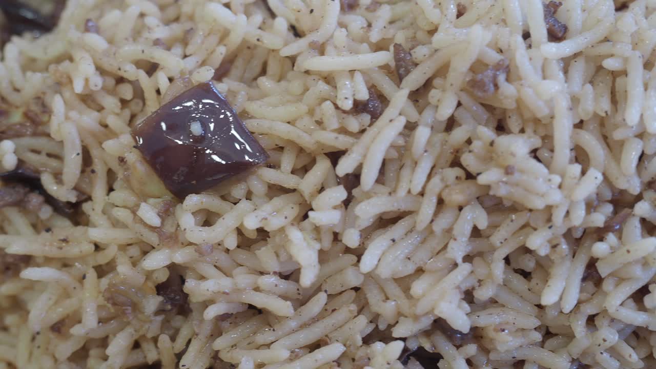 Close-up of a plate of mixed rice with meat