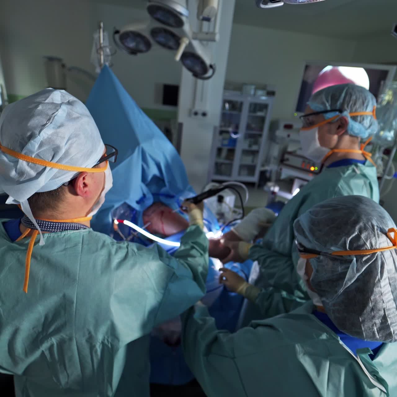 Surgeon in uniform and mask. Professional surgery specialists in emergency room