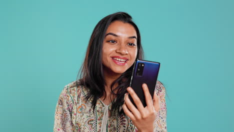 Smiling-woman-having-friendly-conversation-on-videocall