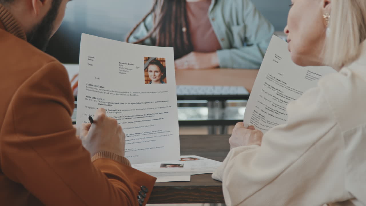 HR Managers Discussing Work with Colleague on Video Call