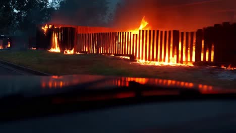 burning wooden fence during a disaster