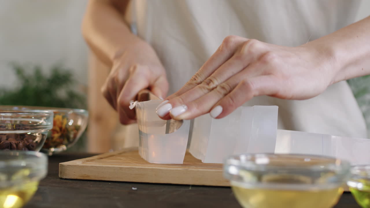Female Hands Dicing Premade Soap Base
