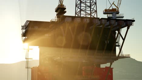 an offshore oil platform at sunset light