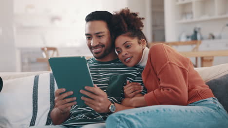 Couple,-sofa-and-tablet-for-home-internet