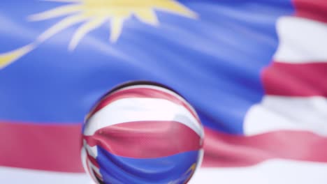 malaysian flag is waving against blue sky in 4k