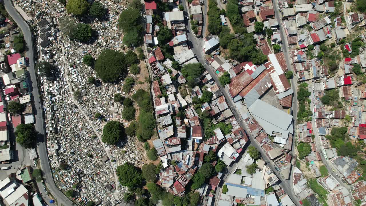 Dense rooftops and a cemetery in guarenas, miranda, venezuela , aerial view