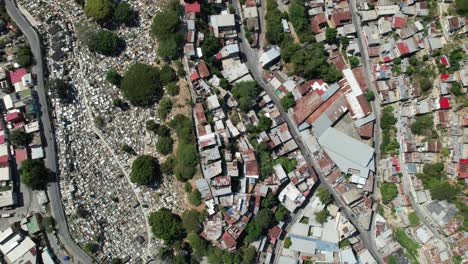 dense rooftops and a cemetery in guarenas, miranda, venezuela , aerial view