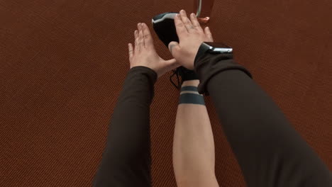 first-person view of a person exercising and stretching