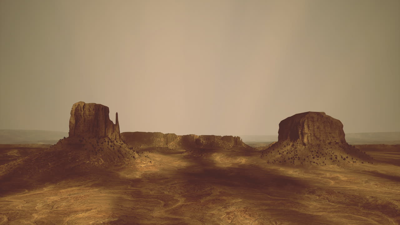 Golden hour casts long shadows over monument valleys majesty